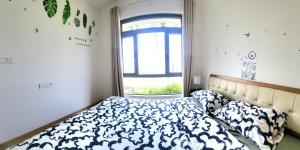 a bedroom with a bed and a window at Seaview Regalia Park, (Happy House), Full Furnished, Free WiFi Forestcity in Gelang Patah
