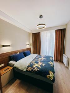 Postel nebo postele na pokoji v ubytování Crystal Loft Apartment Block A 512