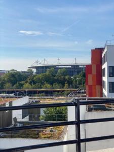 a view of a building with a stadium in the background at Rooftop vue sur le Stade de France in Saint-Denis