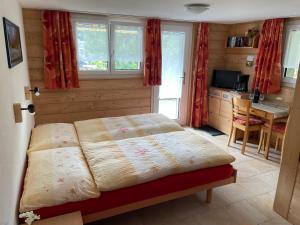 Postel nebo postele na pokoji v ubytování Chalet Kolibri