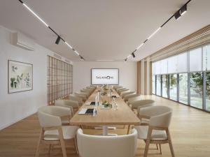 a long conference room with a long table and chairs at Salaya One Hotel & Service Apartment in Salaya