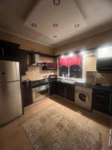 A kitchen or kitchenette at Prime apartment with amazing view in Amman