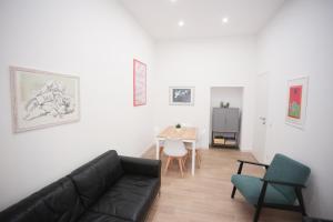 a living room with a couch and a table at Vatican Museum Apartment in Rome