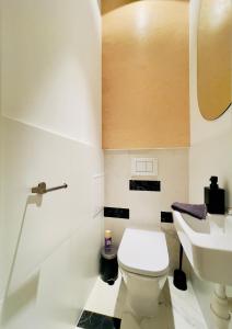 a bathroom with a toilet and a sink at Spacious Apart in the Center- Main Square 300m in Wrocław