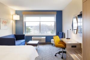 a hotel room with a bed and a desk at Holiday Inn Express Hotel & Suites Van Wert, an IHG Hotel in Van Wert
