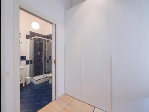 a bathroom with a walk in shower and a toilet at Youhosty - Via Savona 70 in Milan