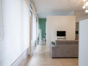 a living room with a couch and a television at Youhosty - Via Savona 70 in Milan