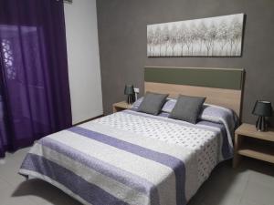 Giường trong phòng chung tại Casa la Tia Mari.