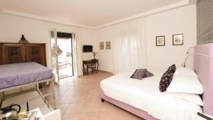 Postel nebo postele na pokoji v ubytování Bella Sorrento B&B