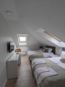 Postel nebo postele na pokoji v ubytování Apartamenty Na Wydmie Półwysep Dziwnów