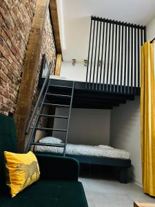 a room with a bunk bed and a staircase at Green Hill Apartments Katowice in Katowice