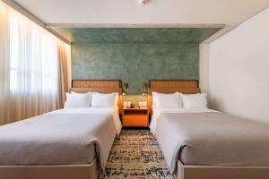Кровать или кровати в номере Canopy By Hilton Sao Paulo Jardins