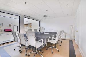 a dining room with a table and chairs at Chateau Mar Golf Resort, Trademark Collection by Wyndham in Lauderhill +37 photos