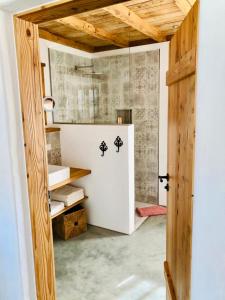 a room with a white refrigerator in a room at Chalet Hochgern in Staudach-Egerndach