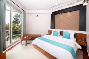 Postel nebo postele na pokoji v ubytování Hotel Sonar Bangla Mandarmoni