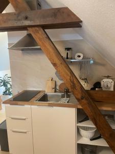 a kitchen with a sink and a counter top at An der Bürgeheide in Finsterwalde