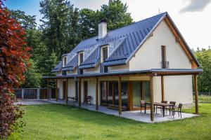 a house with solar panels on the roof at Hájenka Kozlov in Litomyšl