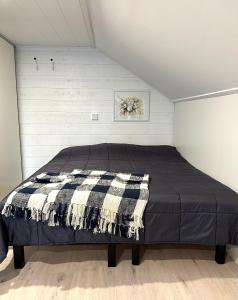 a bedroom with a bed in a room at Cosy berry loft in Rovaniemi