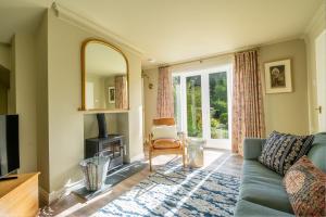 a living room with a couch and a fireplace at 3 The Mews in York