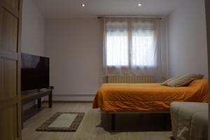 A bed or beds in a room at Cal Abadal - Double room in villa with pool and jacuzzi near Barcelona
