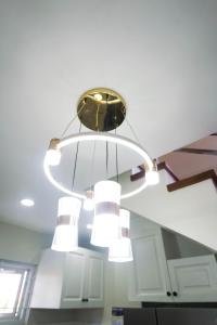 a chandelier hanging from the ceiling in a kitchen at Luxurious Place Mountain View Spacious with WIFI Near SM Lucena in Lucena +88 photos