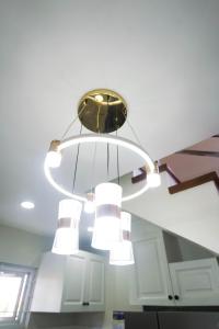 a chandelier hanging from the ceiling in a kitchen at Luxurious Place Mountain View Spacious with WIFI Parking in Lucena