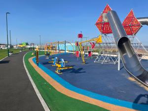 a park with a playground with a slide at The Waterside in Redcar