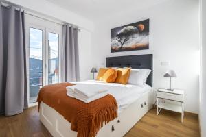 Tempat tidur dalam kamar di Il Tramonto by Madeira Sun Travel