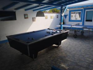 a large pool table in a room with a pool table at Blue Bungalow Jurilovca in Jurilovca