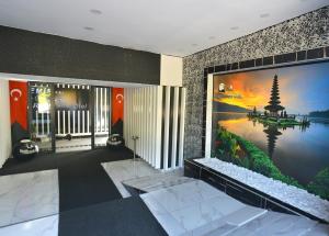a lobby with a large mural on the wall at La Rezidans Hotel in Antalya