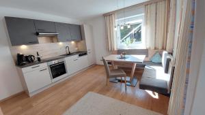 Kuchyň nebo kuchyňský kout v ubytování Appartement Tamara