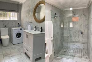 a bathroom with a shower and a washing machine at Thornton Gap Guesthouse in Johannesburg