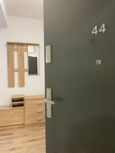 a room with a door with the number on it at Apartament Stajnia Jednorożca in Łódź