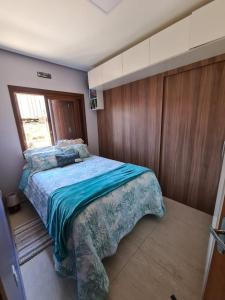 Cama ou camas em um quarto em Refúgio dos Coiotes