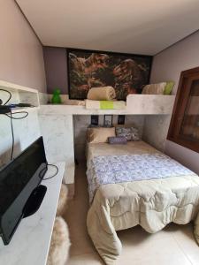 Cama ou camas em um quarto em Refúgio dos Coiotes