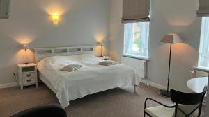 Postel nebo postele na pokoji v ubytování Hotel Seemöwe