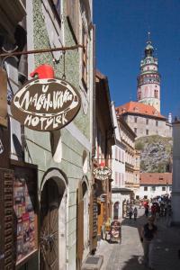 a street with a sign on the side of a building at Hotel U Malého Vitka in Český Krumlov