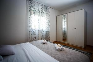Postel nebo postele na pokoji v ubytování Rogoznica Apartments Kristina