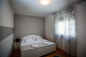 Postel nebo postele na pokoji v ubytování Rogoznica Apartments Kristina