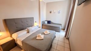 Ένα ή περισσότερα κρεβάτια σε δωμάτιο στο Residence Marittimo Riccione