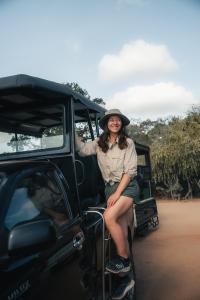 a woman sitting in the back of a vehicle at Wild Trails Yala by Suri in Yala