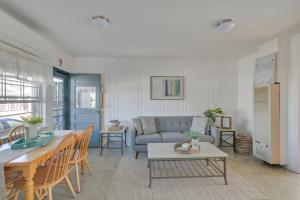 a living room with a couch and a table at Cozy Hampton Vacation Rental, Walk to Beach! in Hampton