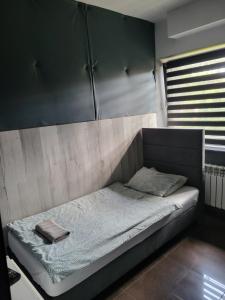 Łóżko lub łóżka w pokoju w obiekcie M Hostel