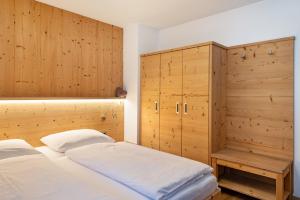 Postel nebo postele na pokoji v ubytování Stoffel Apartments Martina