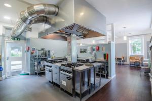 a large kitchen with a large stove top oven at Lochranza Youth Hostel in Lochranza