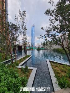 a view of a river with a building in the background at Infinity Pool Suite Bukit Bintang Lalaport BBCC Kuala Lumpur in Kuala Lumpur