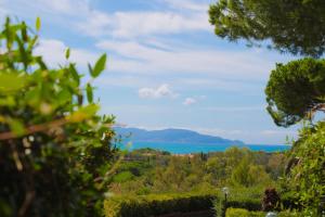 a view of the lake from the garden at Argentario Osa Resort in Talamone