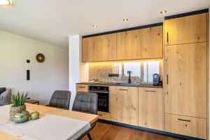 Kuchyň nebo kuchyňský kout v ubytování Sunnseitn Lodge Apartment Alps