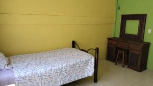 מיטה או מיטות בחדר ב-Casa la flor de loto