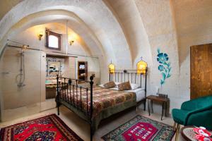 Postel nebo postele na pokoji v ubytování Carna Cave Hotel Cappadocia